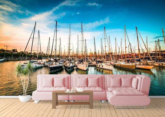 Wall Mural - View of the pier with yachts against the backdrop of a beautiful sunset.