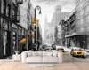 Wall Mural - Yellow taxi in a black and white city