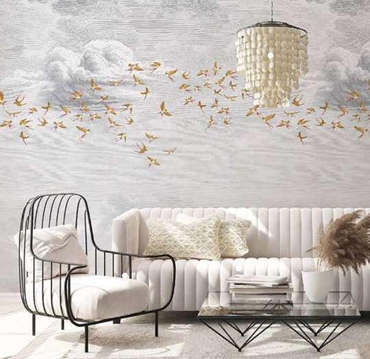 Wall Mural - Golden birds on the background of clouds